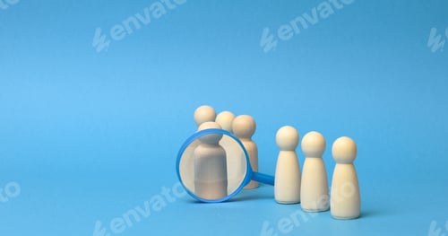 Preview: Wooden figures of men stand on a blue background and a plastic magnifying glass