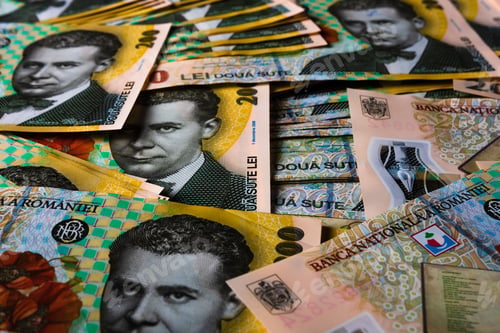 Preview: Closeup of the Romanian LEI bill pile spread on a table