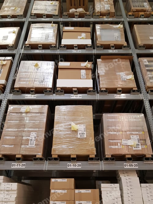 Preview: Racks with boxes in a hypermarket warehouse