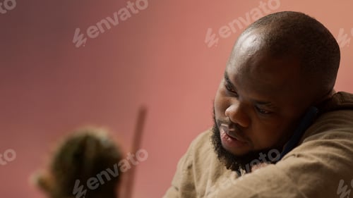 Preview: Business owner having a chat on phone call with the shareholders