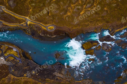 Preview: Beautiful view of a river surrounded by hills on a cloudy day