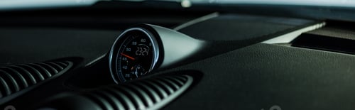 Preview: KYIV, UKRAINE - OCTOBER 7, 2019: panoramic shot of black speedometer in luxury porshe