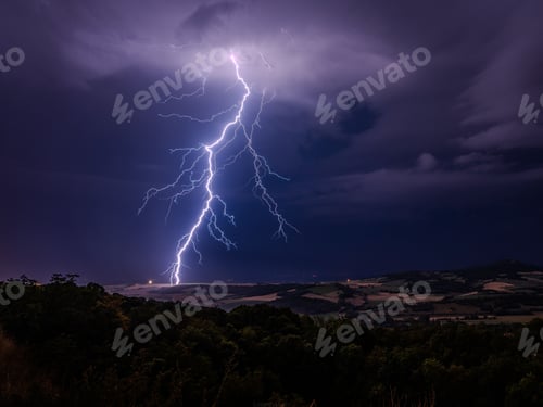 Preview: Dramatic lightning over rural landscape.