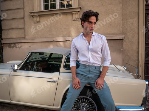 Preview: Handsome, Sexy, Young Man Posing Near Retro Car. Looking Away.