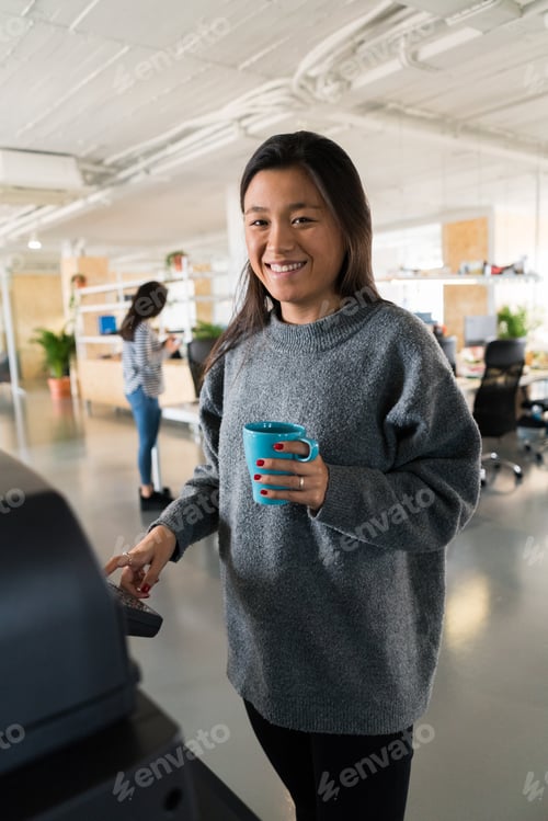 Preview: Smiling woman in office posing