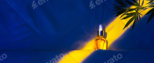 Preview: Oil tincture with cannabis in moonlight at night on bed with hemp branch