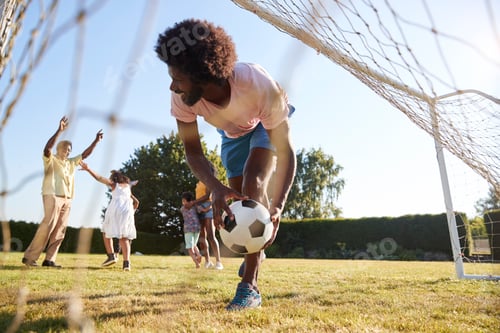 Preview: Dad saving goal during multi generation family football game