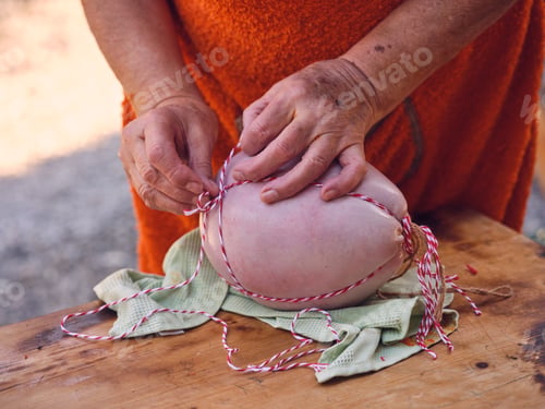Preview: Elderly person sewing natural sausage