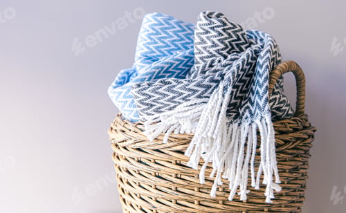 Preview: Textured plaids in a wicker basket on a gray background.