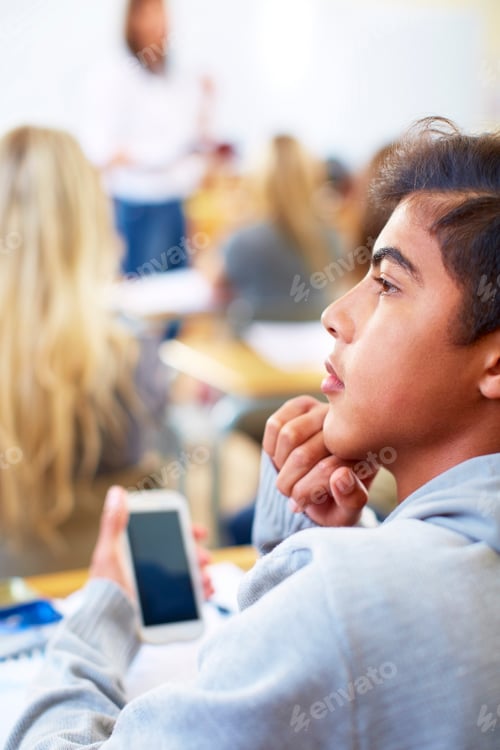 Preview: Student using cell phone in classroom