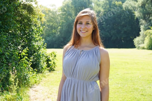 Preview: smiling young woman in a park