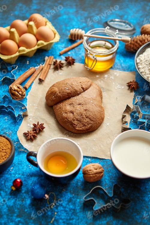 Preview: Gingerbread dough placed among various ingredients. Christmas baking concept