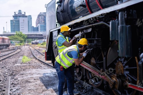 Preview: Engineer railway wearing safety gear checking train transmittal system for safety travel passenger
