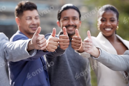 Preview: Its a yes from us. Portrait of a group of businesspeople showing a thumbs up outside.