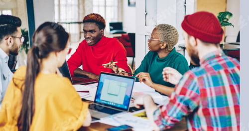 Preview: Diverse hipster guys analyzing information while brainstorming in coworking