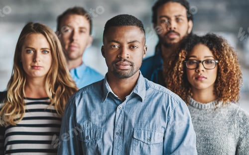 Preview: Were the team you want. Portrait of a group of creative businesspeople standing in their office.