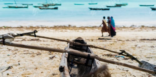 Preview: sandy beach of fishing village with wooden boats in Zanzibar
