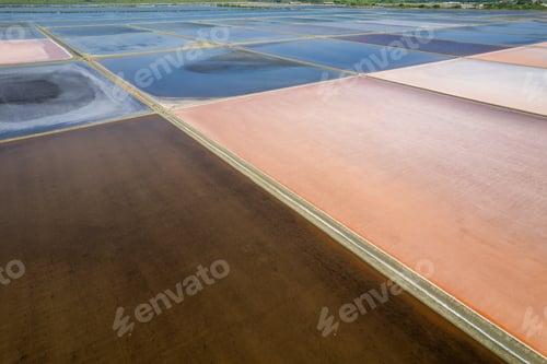 Preview: Aerial drone photo of colourful salt flats textures in Phetchaburi, Thailand