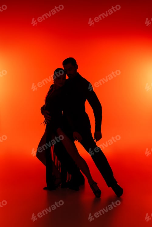 Preview: Silhouette of ballroom dancers performing tango on red background