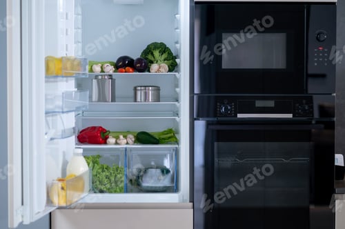 Preview: Open Refrigerator Full of Fresh Vegetables and Produce