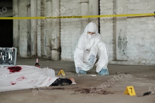 Preview: Criminological experts in coveralls, gloves and mask picking up evidences