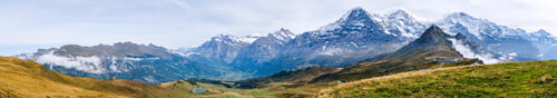 Preview: Wide panorama of Grindelwald valley and Swiss Alps. Mountain range from Mannlichen, Switzerland