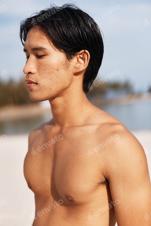 Preview: Active Asian Man Enjoying a Sunset Run on the Beach, Embracing the Fitness Lifestyle