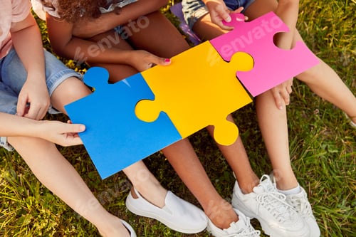Preview: Diverse kids playing with puzzle together