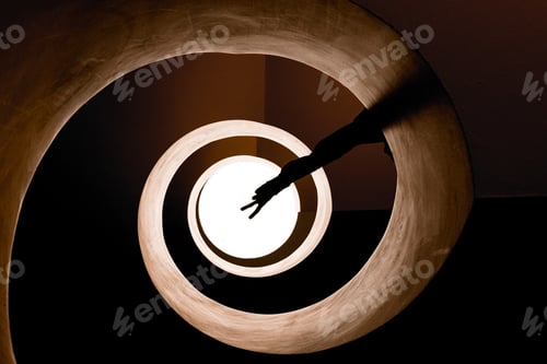 Preview: Silhouette of a hand stretched out showing peace sign in a spiral hallway