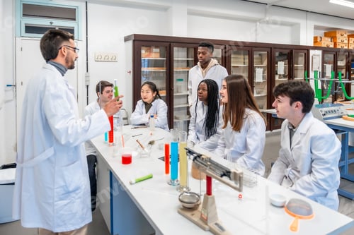 Preview: Chemistry teacher explaining experiment to students in university laboratory