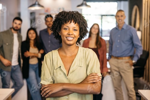 Preview: Confident black woman leading diverse business team in office
