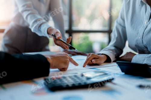 Preview: Image of a group of business people meeting using a tablet and calculating calculator to plan, analy