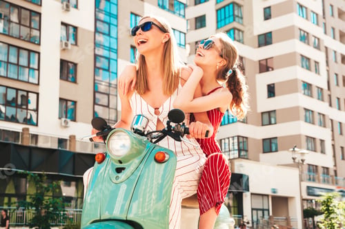 Preview: Two young beautiful woman posing outdoors