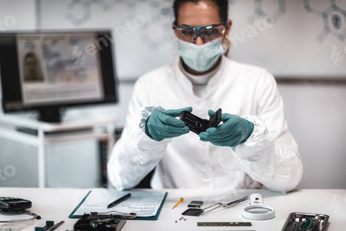 Preview: Forensics. Police Expert Examining Confiscated Mobile phone
