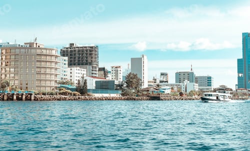 Preview: sea view of Male city of the capital of the Maldives and skyscrapers, transfer from the airport