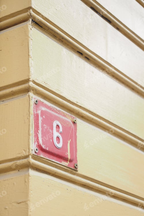 Preview: Vintage House Number 6 displayed beautifully on a charming Yellow Wooden Wall surface