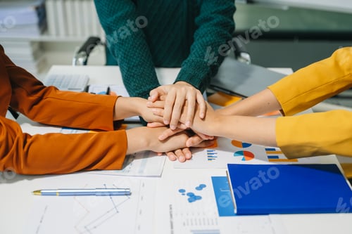Preview: Close up on hands of business people join together their hands together on unity concept