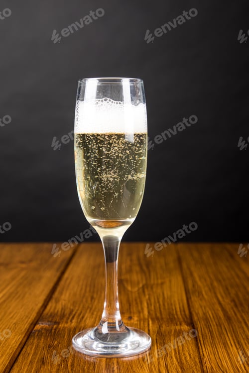 Preview: champagne glass on a wooden background