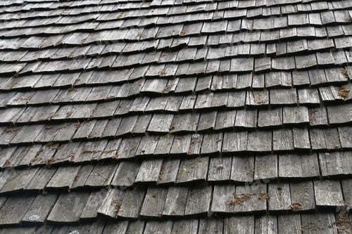 Preview: Closeup of a traditional wooden roof tile of an old house