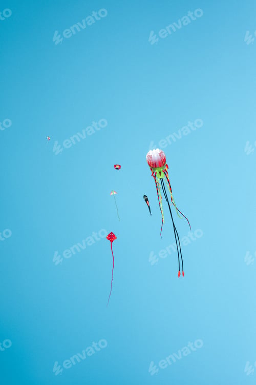 Preview: Colorful kite in the blue sky during the daytime