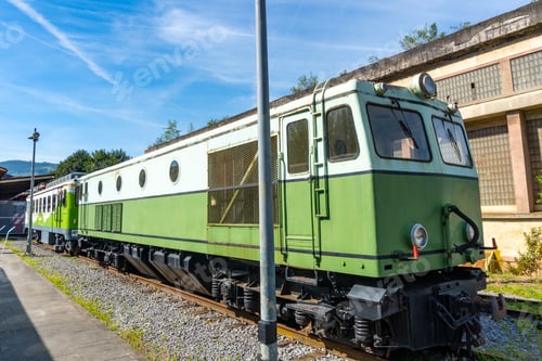 Preview: A green train is parked on the tracks