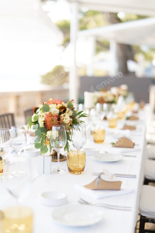 Preview: Long table set with bouquets of flowers and invitation succulents