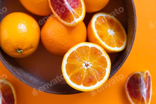 Preview: Fresh juicy oranges on colorful background