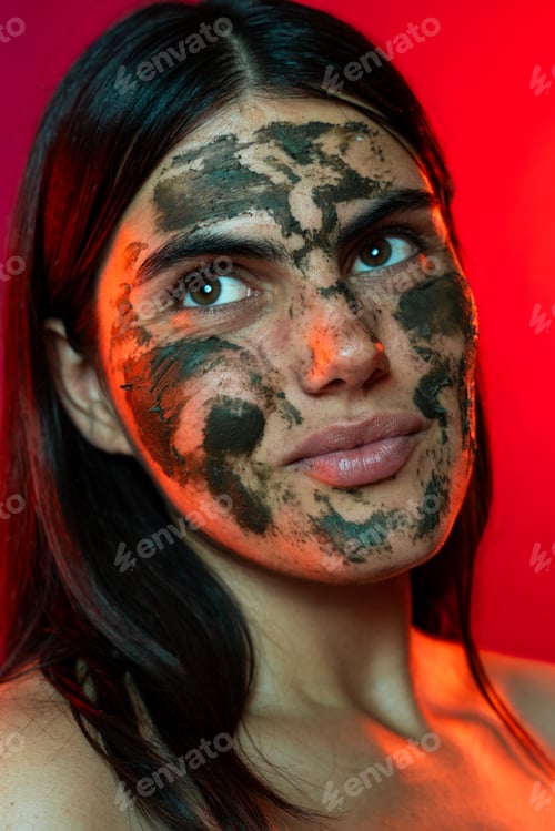 Preview: Young woman embracing skincare with natural face mask