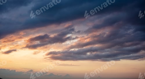 Preview: Sunrise clouds. Dramatic magical sunset over orange cloudy sky