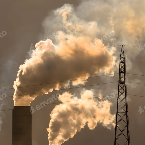 Preview: Chimneys emitting smoke and electric pylon.