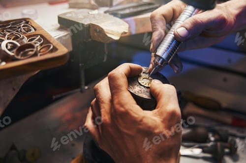 Preview: Jewelry expert bringing power drill to golden pendant