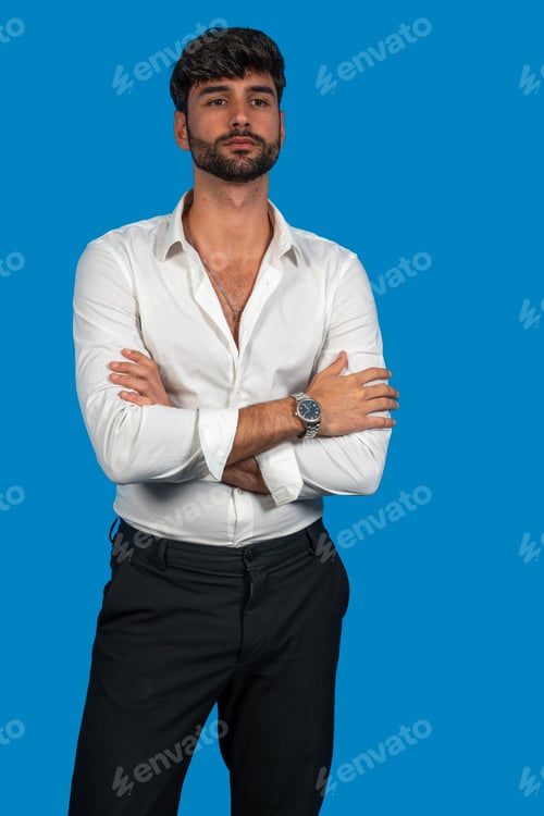 Preview: Confident businessman crossing arms on blue background