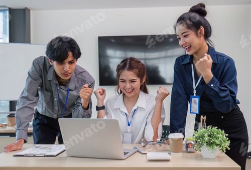 Preview: Group of Young Asian business team creative businesspeople coworker in office Happy to be successful