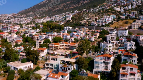 Preview: Aerial view of beautiful cityscape surrounded by mountains.